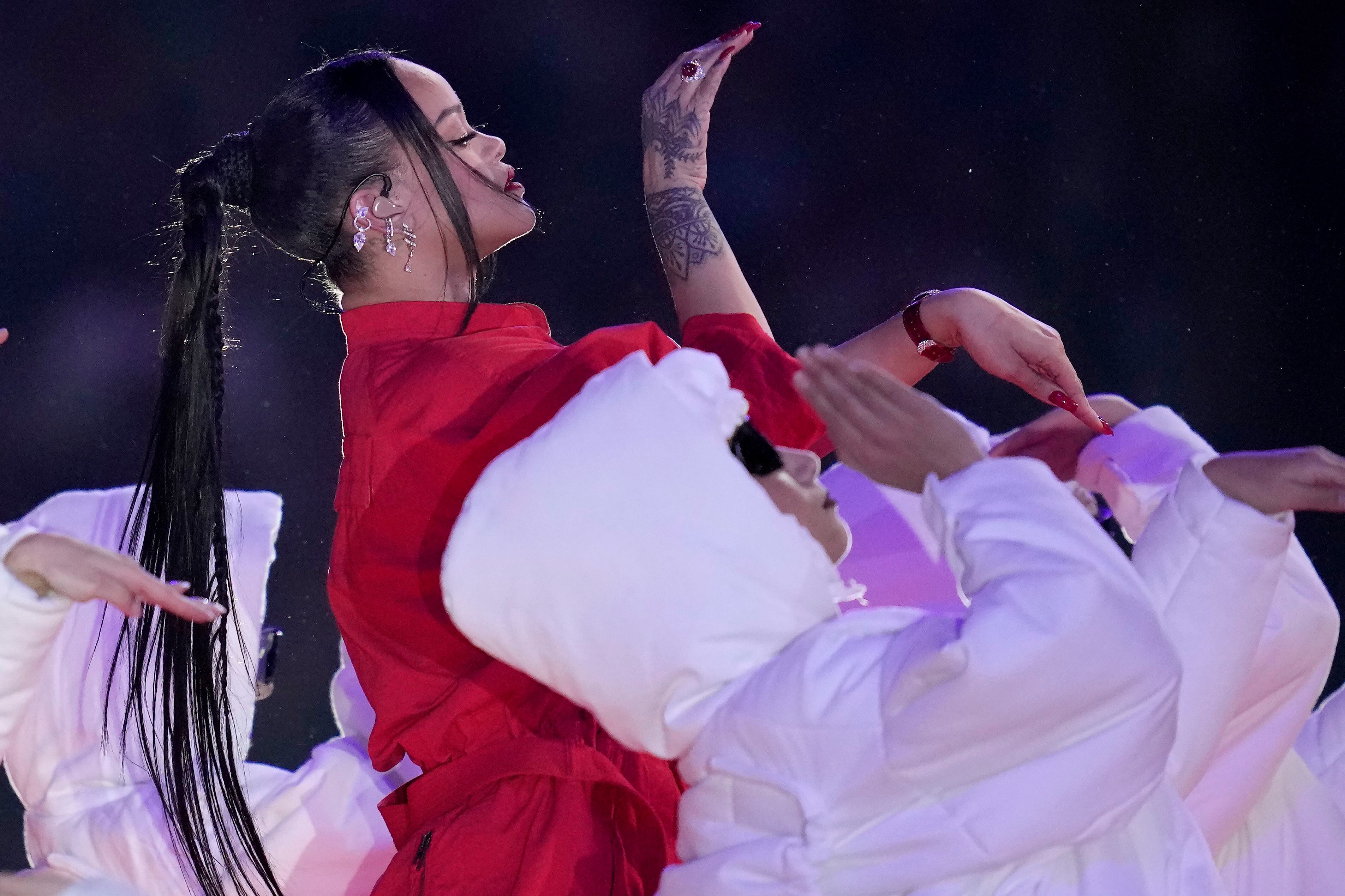 Rihanna Soars In Super Bowl Halftime Show; Reveals New Baby Bump