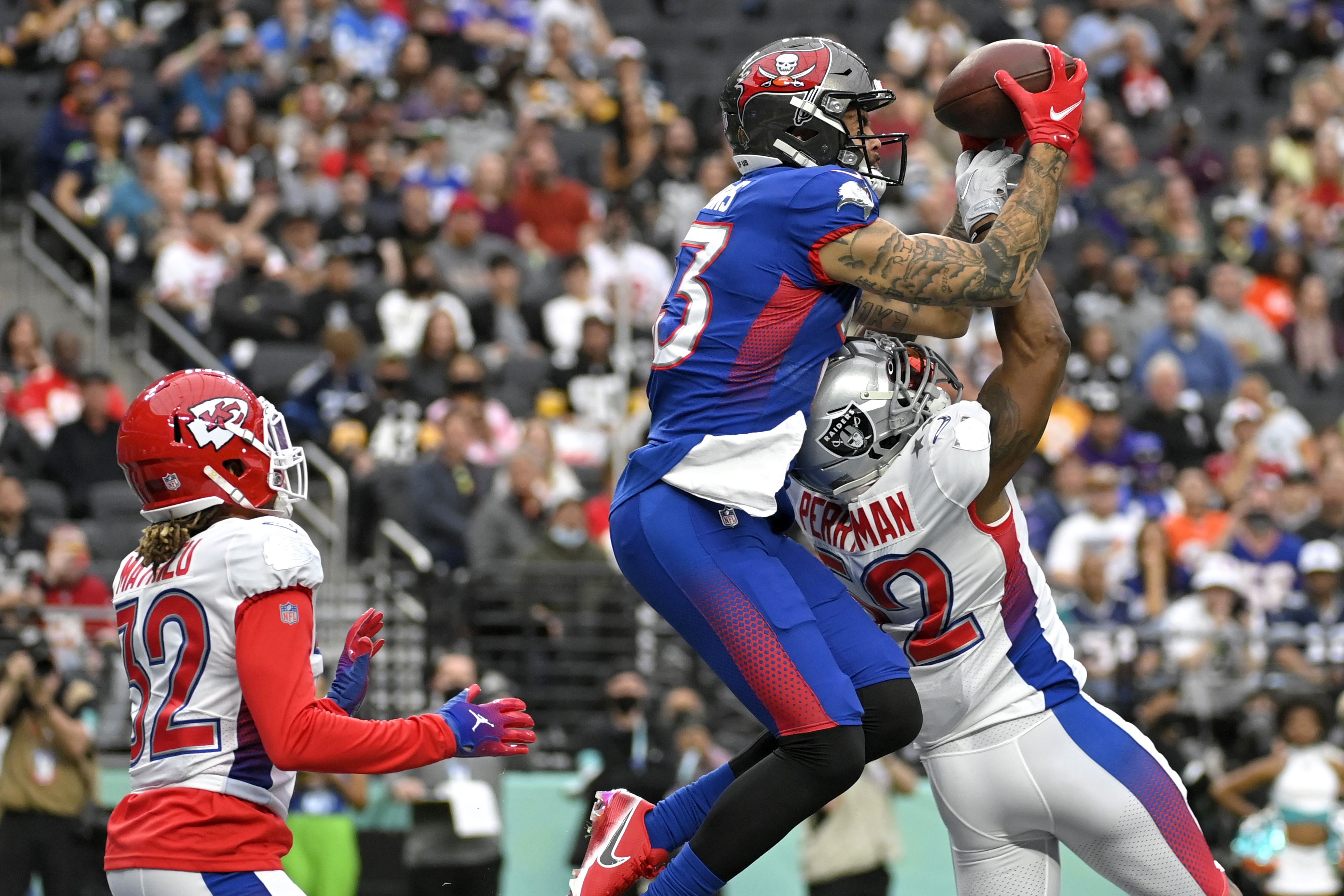 NFC wide receiver Mike Evans of the Tampa Bay Buccaneers (13) runs the ball  in for a touchdown against the AFC during the Pro Bowl NFL football game,  Sunday, Feb. 6, 2022