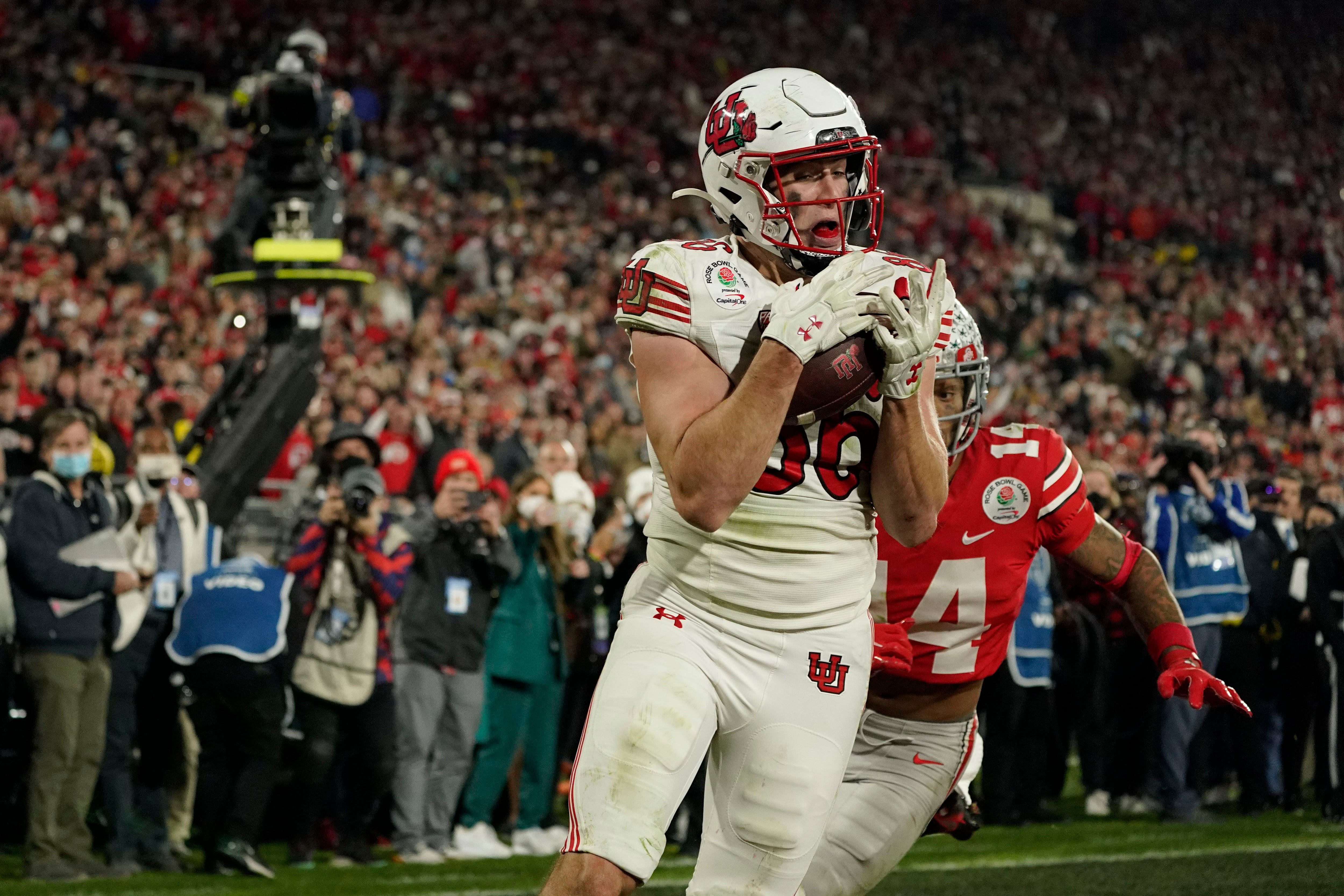 Ohio State wide receiver Marvin Harrison Jr., right, catches a touchdown  during the first half in the Rose Bowl NCAA college football game against  Utah Saturday, Jan. 1, 2022, in Pasadena, Calif. (