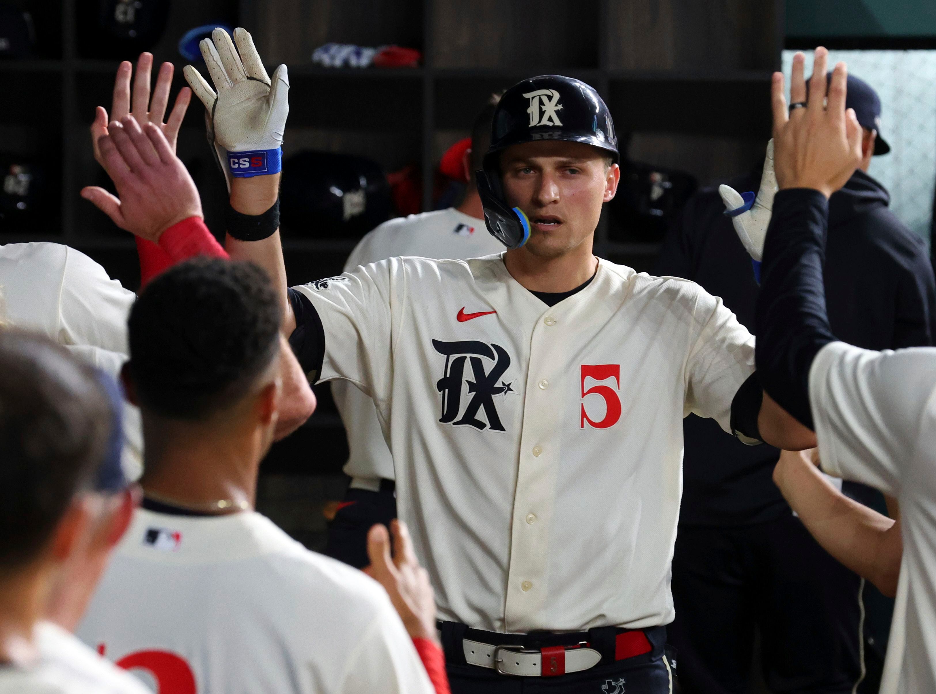 Texas Rangers' Ezequiel Duran, left, is caught stealing second