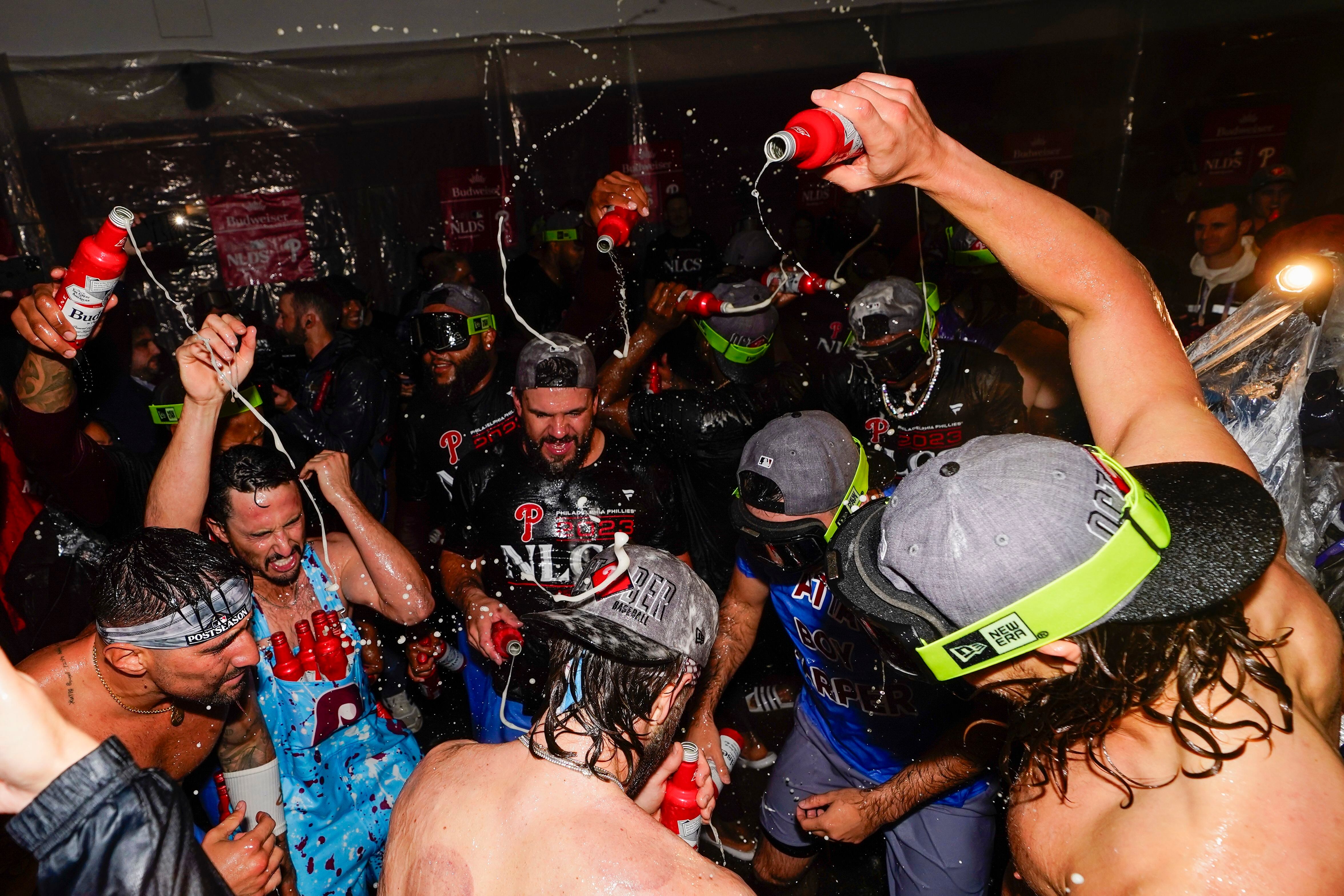 Members of the Philadelphia Phillies celebrate in the locker room