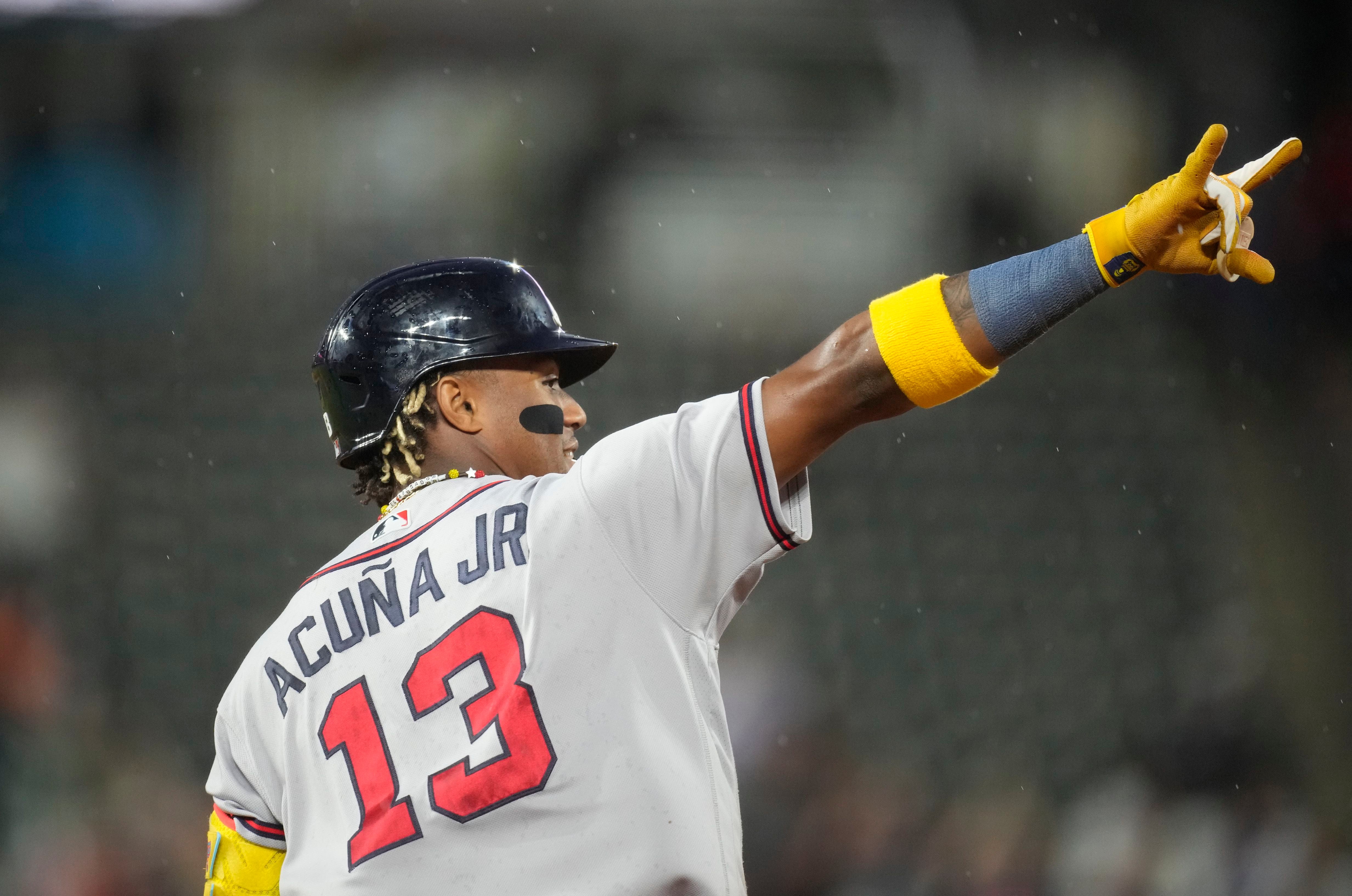 Ronald Acuña Jr. knocked over by fan charging field in Colorado