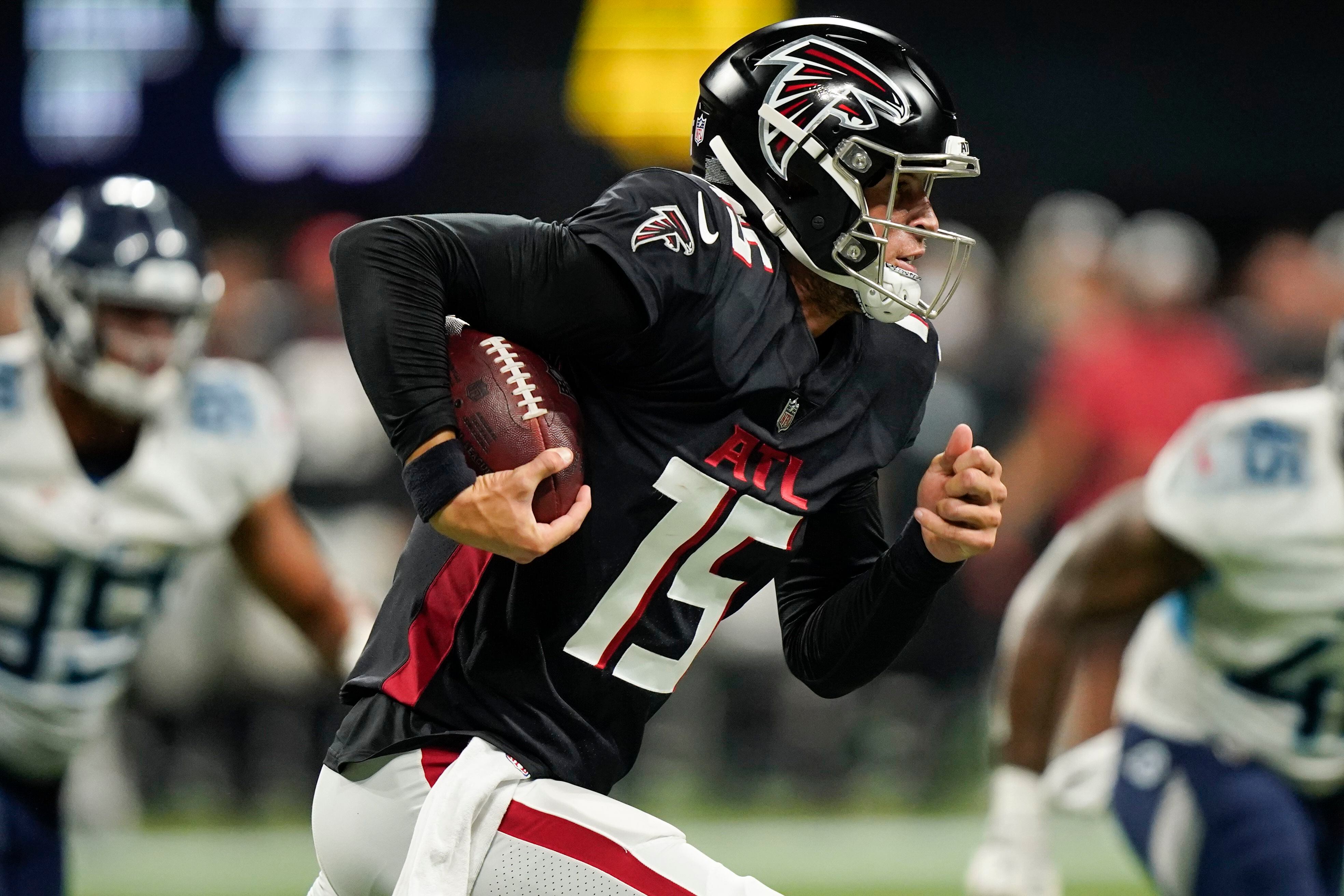 Atlanta Falcons quarterback Logan Woodside (11) runs with the ball