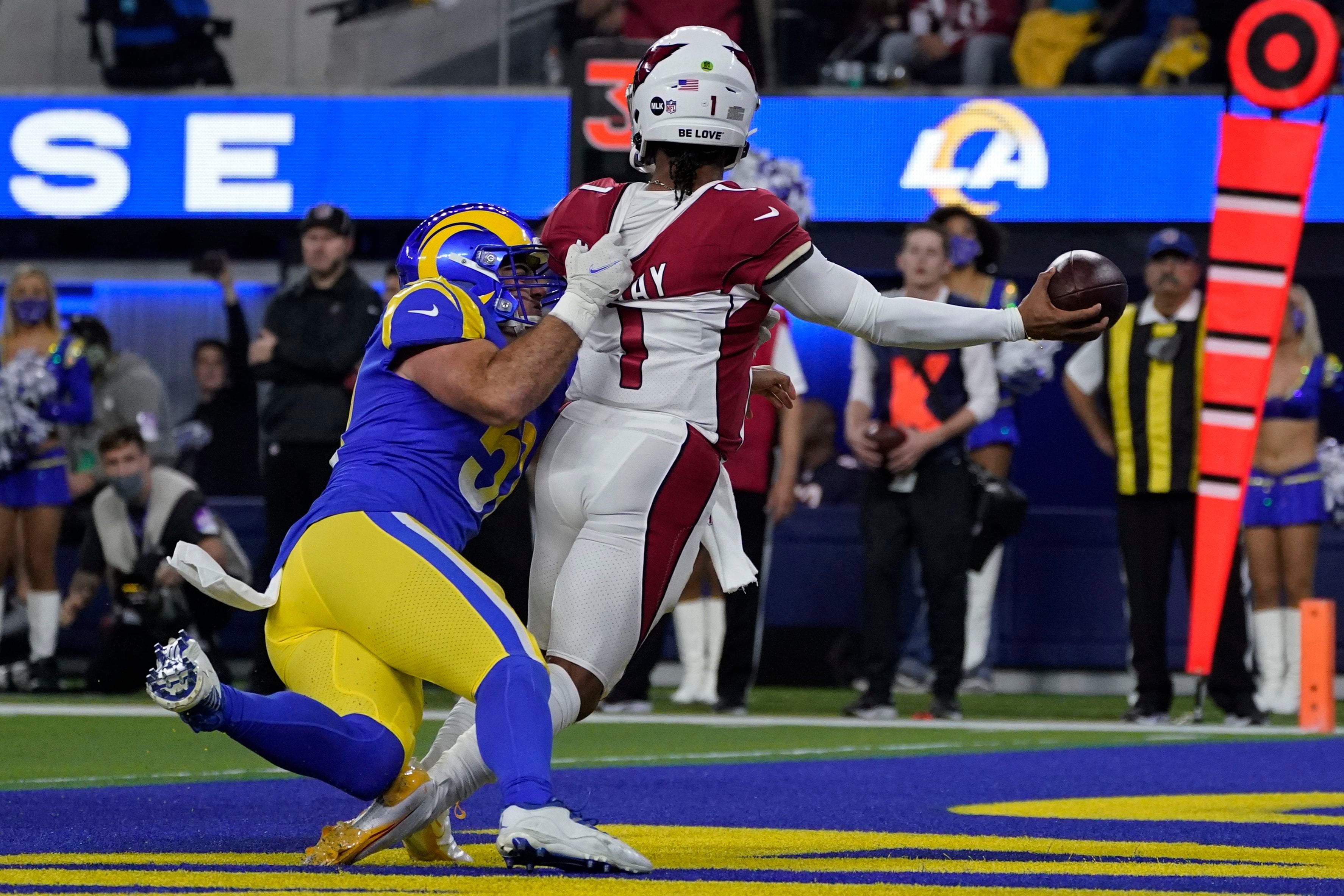 Stafford propels Rams past Cardinals 34-11 in playoff rout