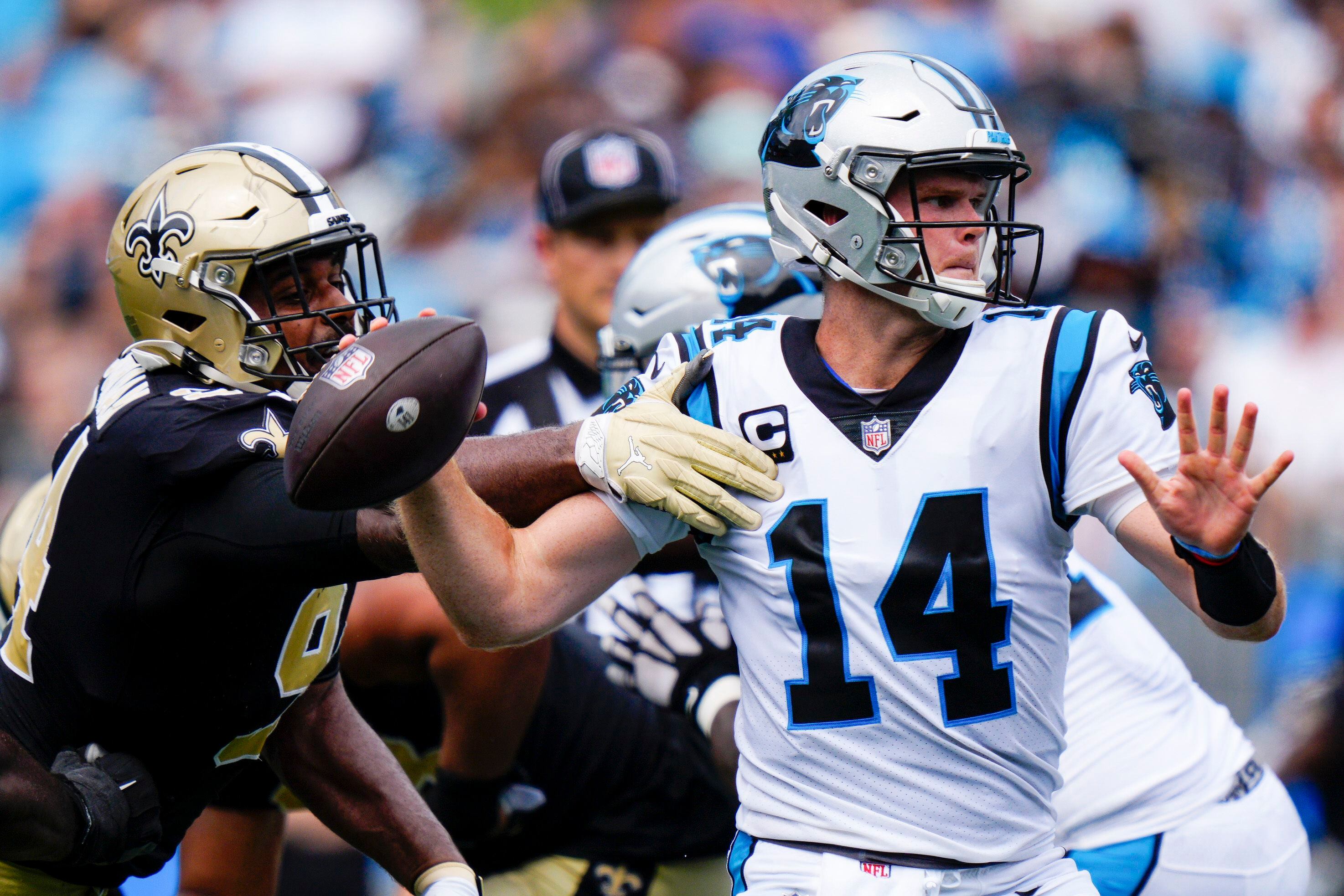 New Orleans Saints quarterback Jameis Winston (2)looks to hand off the  football against the Carolina Panthers during the second half of an NFL  football game Sunday, Sept. 19, 2021, in Charlotte, N.C. (