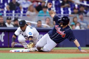 Marlins stop 5-game slide with 14-inning win over Cubs