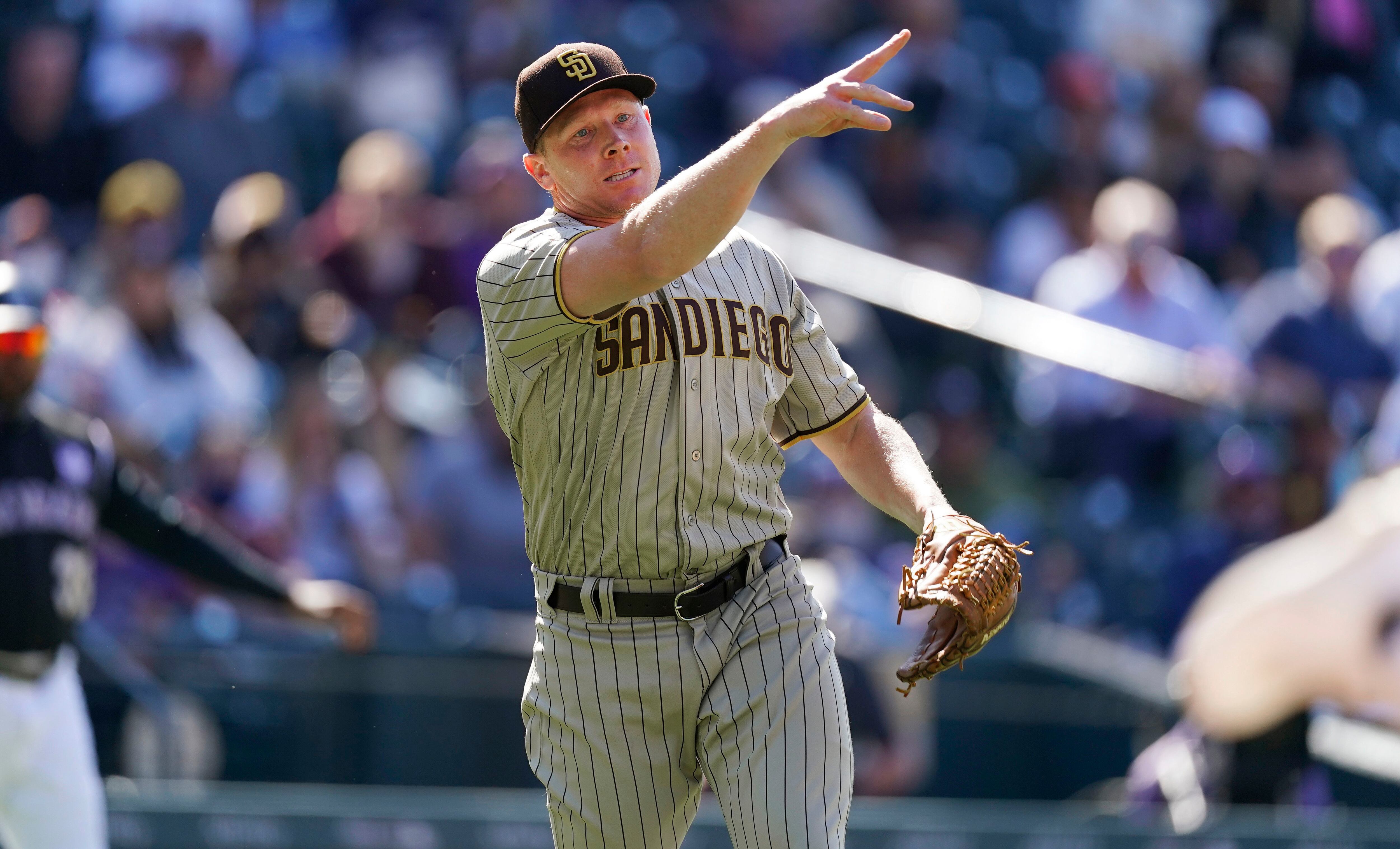 San Diego Padres' Victor Caratini heads up the first-base line after  connecting for a grand slam off Colorado Rockies relief pitcher Robert  Stephenson in the sixth inning of game one of a