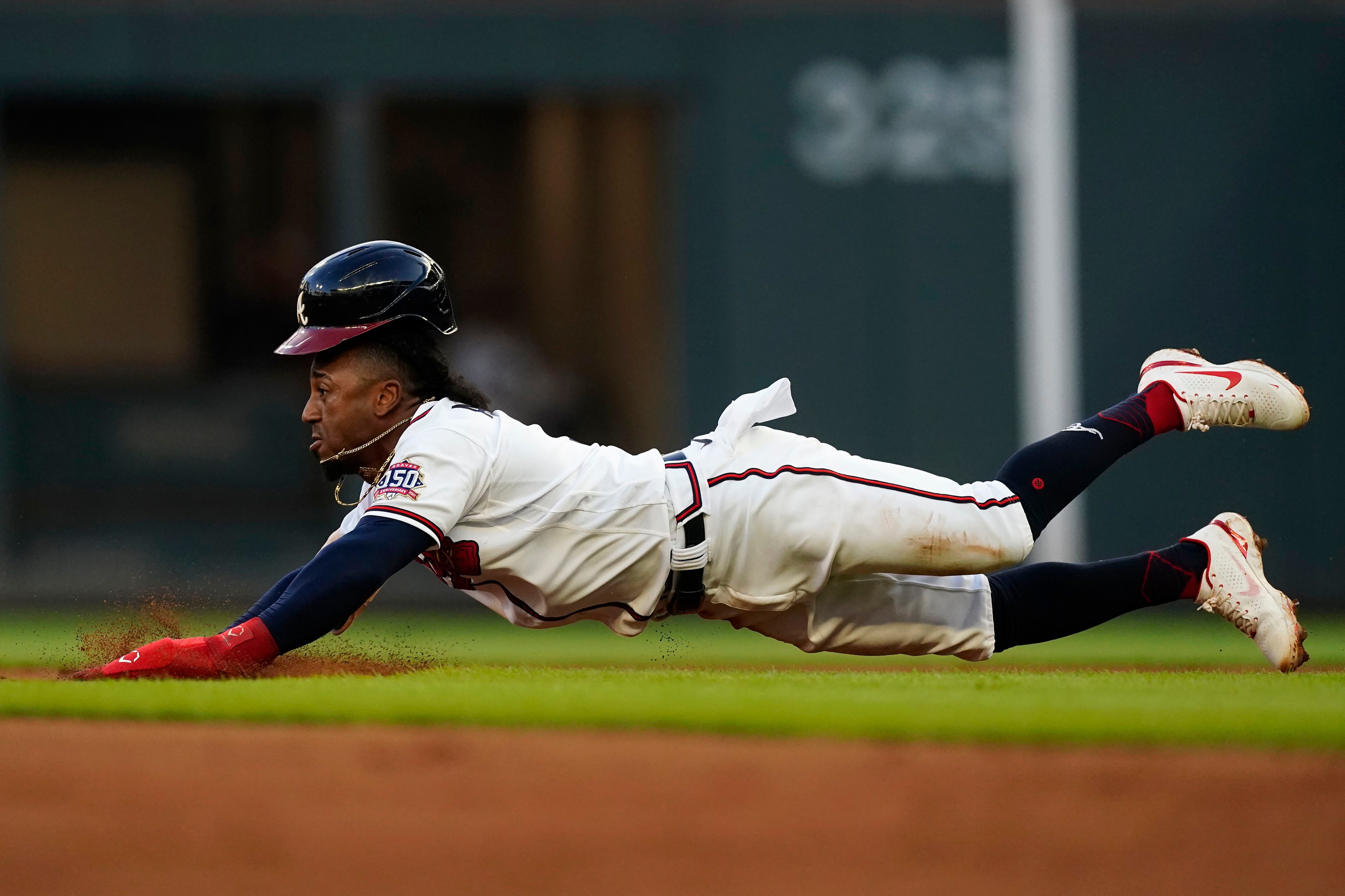 San Francisco Giants center fielder Mike Yastrzemski (5) makes a running  catch on a fly ball from Atlanta Braves' Eddie Rosario in the seventh  inning of a baseball game Saturday, Aug. 28