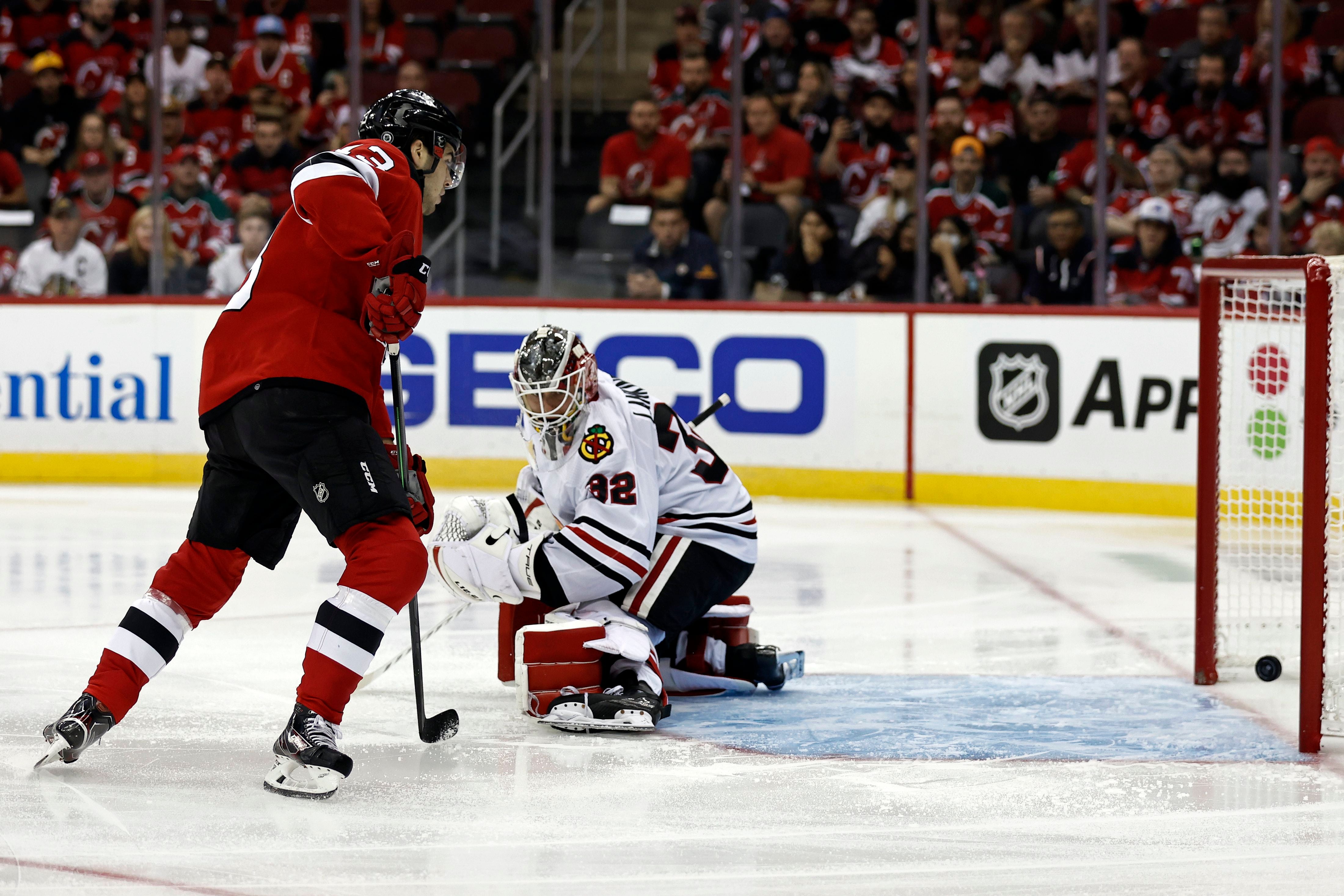 Chicago Blackhawks center Kirby Dach, right, celebrates his tying