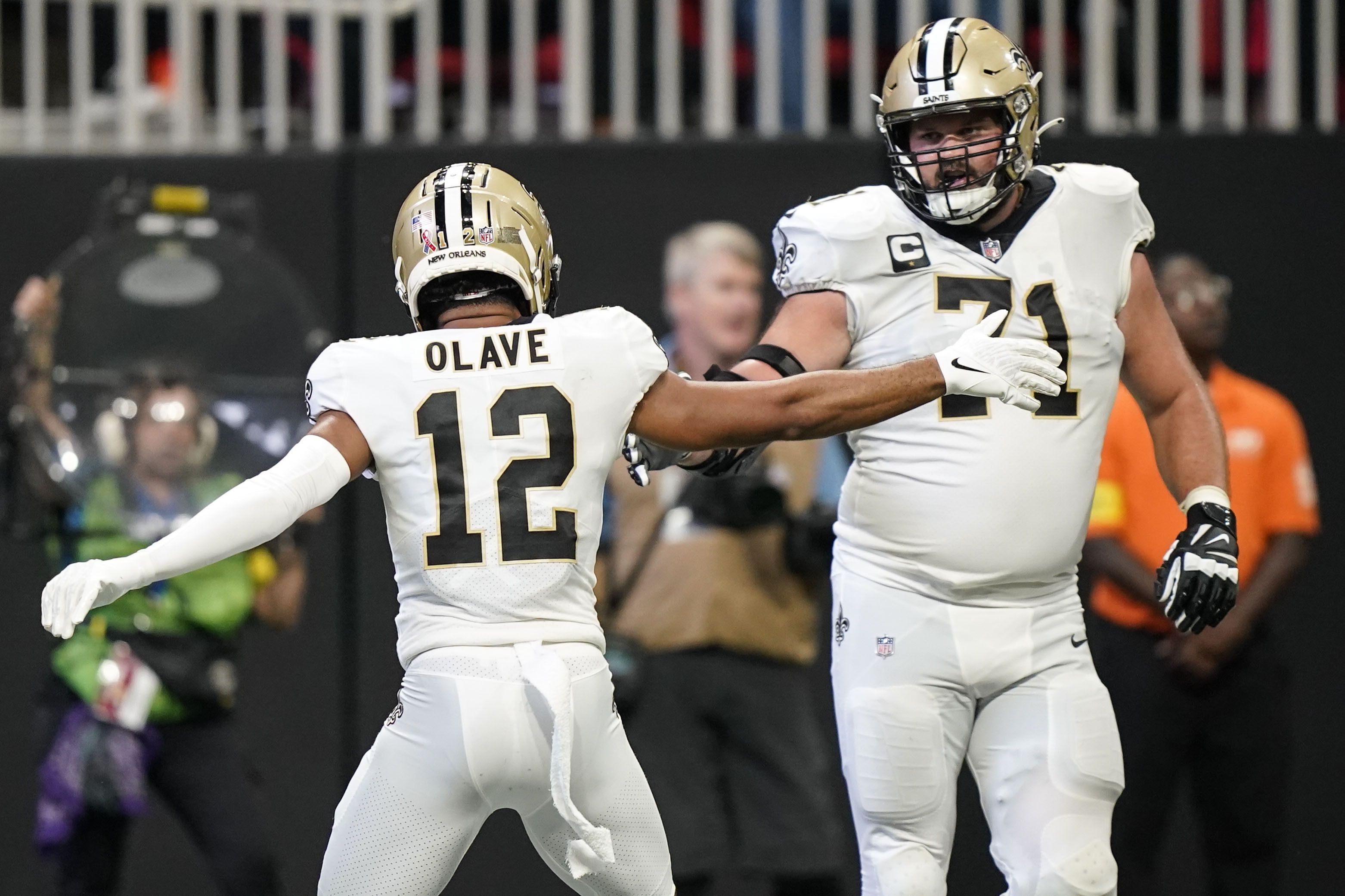 New Orleans Saints wide receiver Michael Thomas (13) celebrates a touchdown  with tight end Juwan Johnson (83) during the second half of an NFL football  game against the Atlanta Falcons, Sunday, Sep.