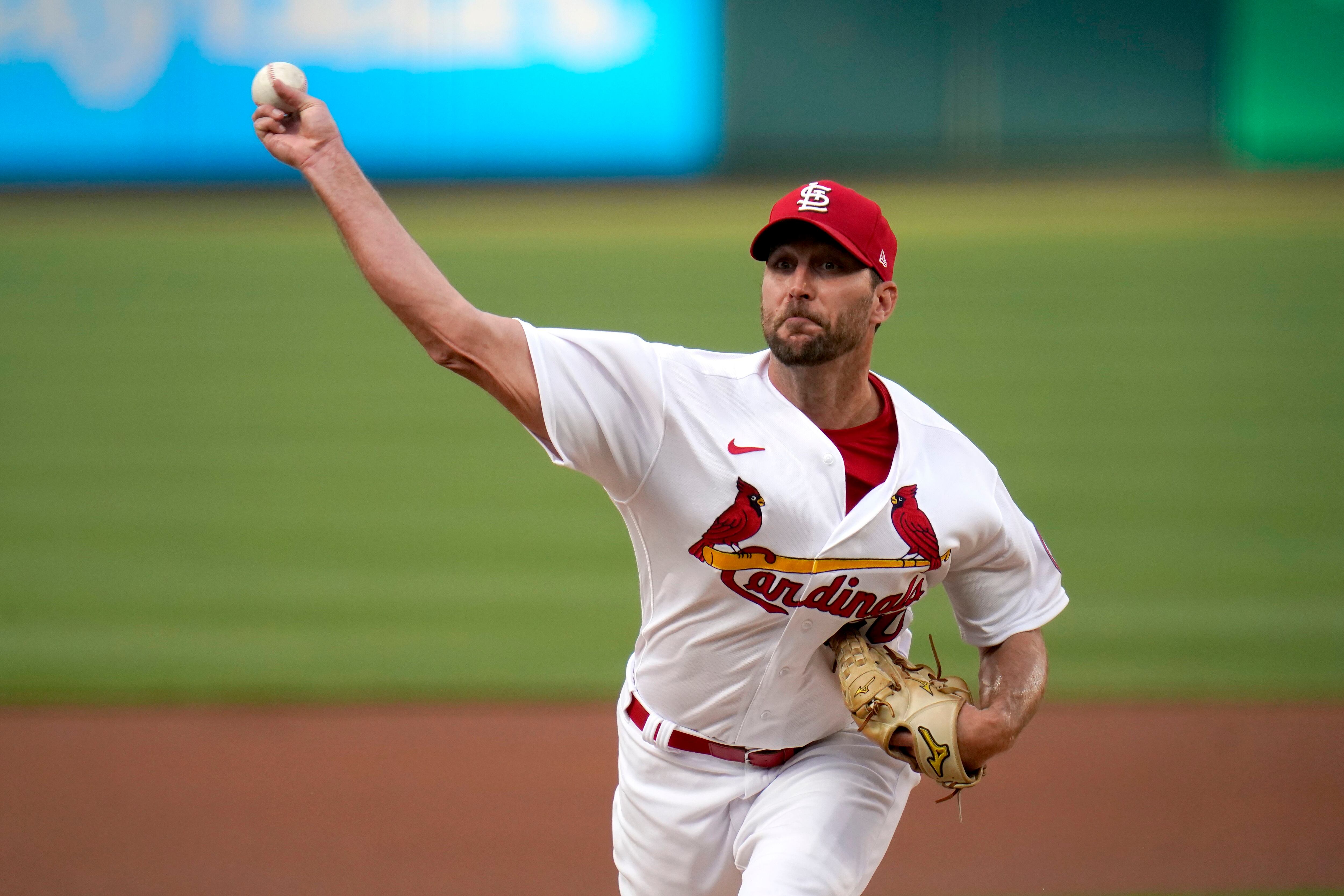 St. Louis Cardinals Harrison Bader makes a throw to first base in