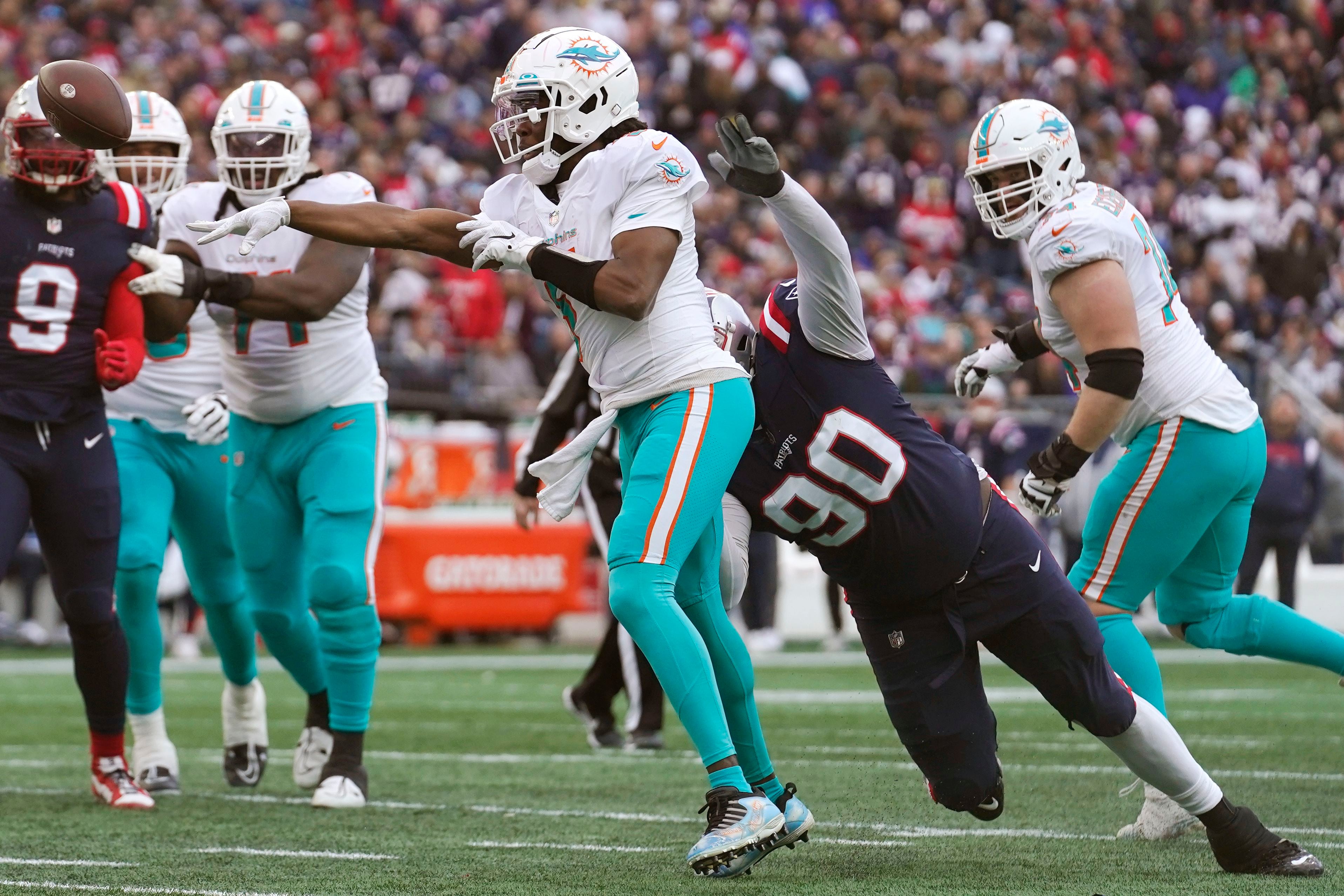 Dugger interception return helps Patriots beat Dolphins 23-21