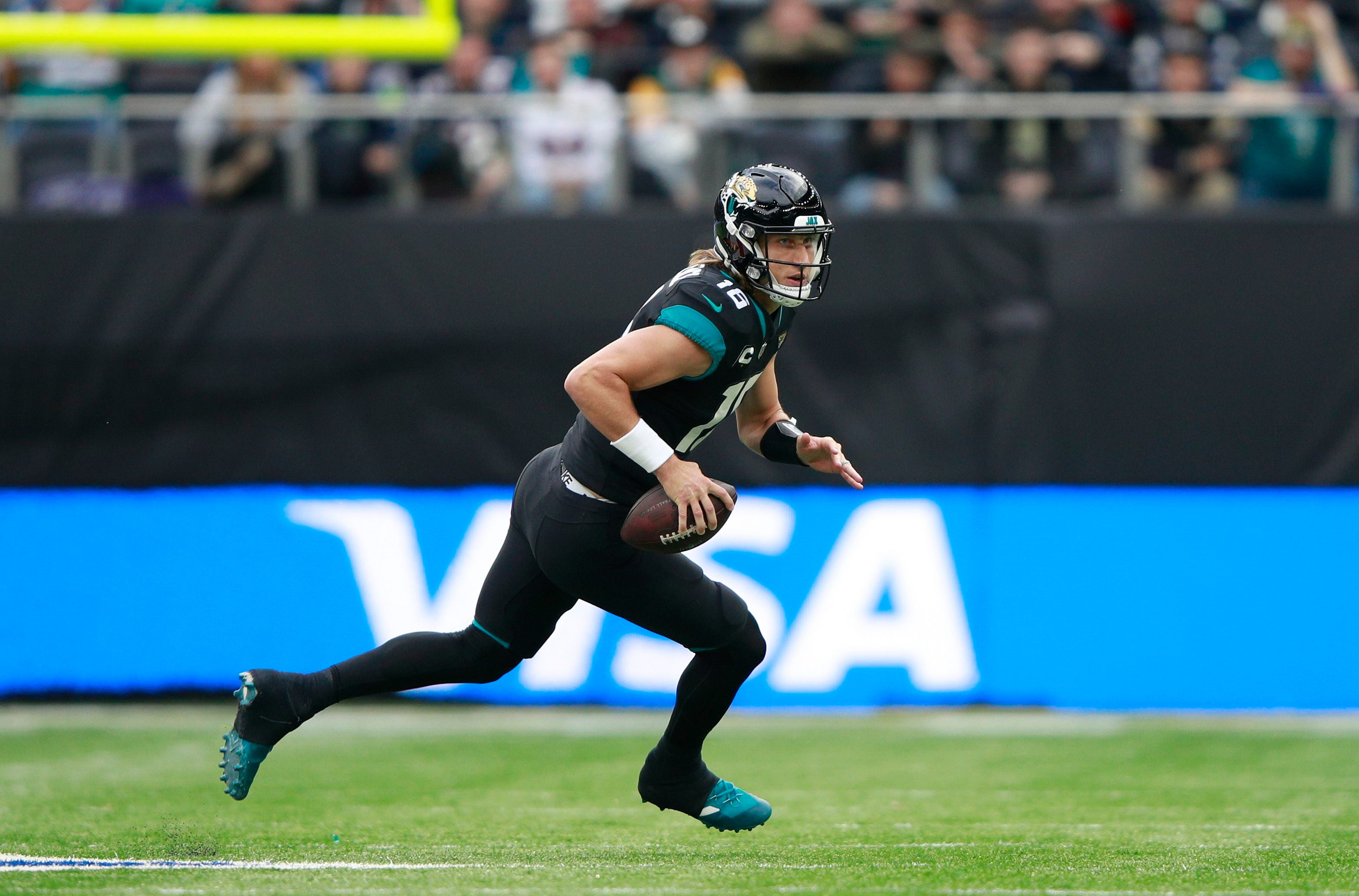 Miami Dolphins wide receiver Jaylen Waddle (17) catches a pass and turns to  make the touchdown during an NFL International Series game against the  Jacksonville Jaguars at Tottenham Hotspur Stadium, Sunday, Oct.