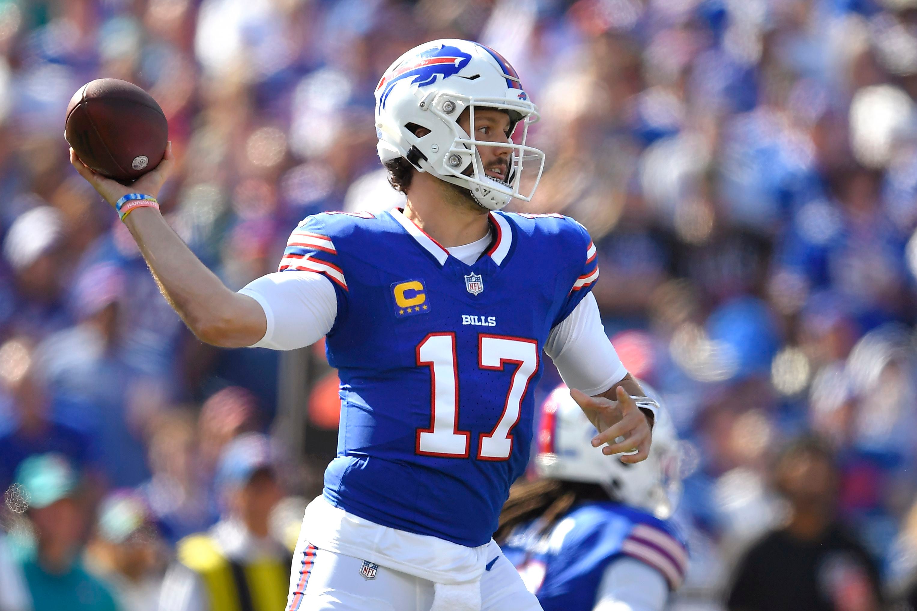 Josh Allen throws 4 TD passes, runs for score, Bills rout division