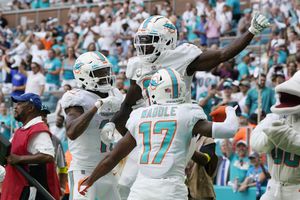 Tagovailoa stays hot, throws for 3 TDs, Dolphins rout Browns - The San  Diego Union-Tribune