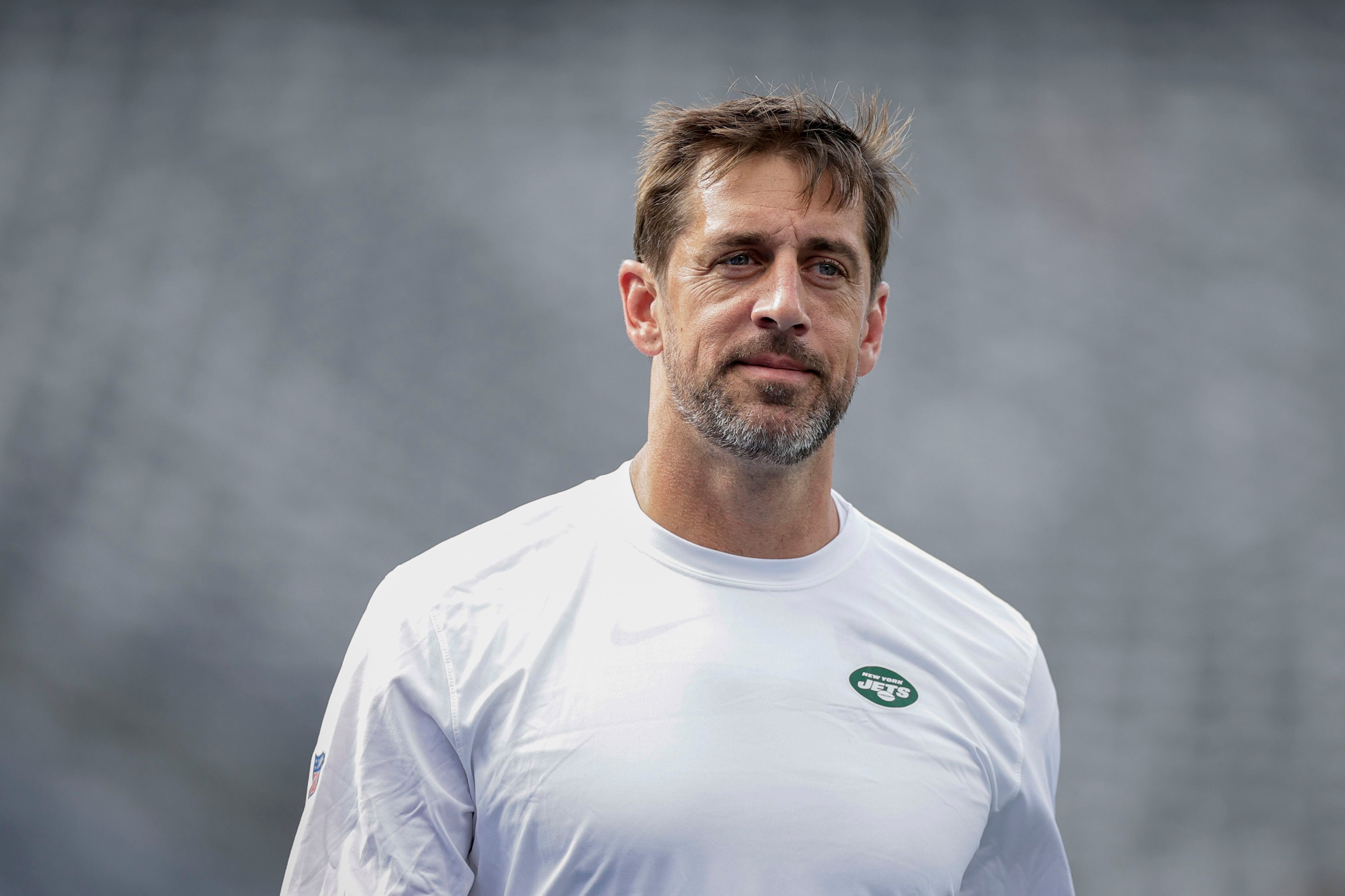 New York Jets quarterback Aaron Rodgers (8) calls out a play to his  teammates during the first half of an NFL preseason football game against  the New York Giants, Saturday, Aug. 26