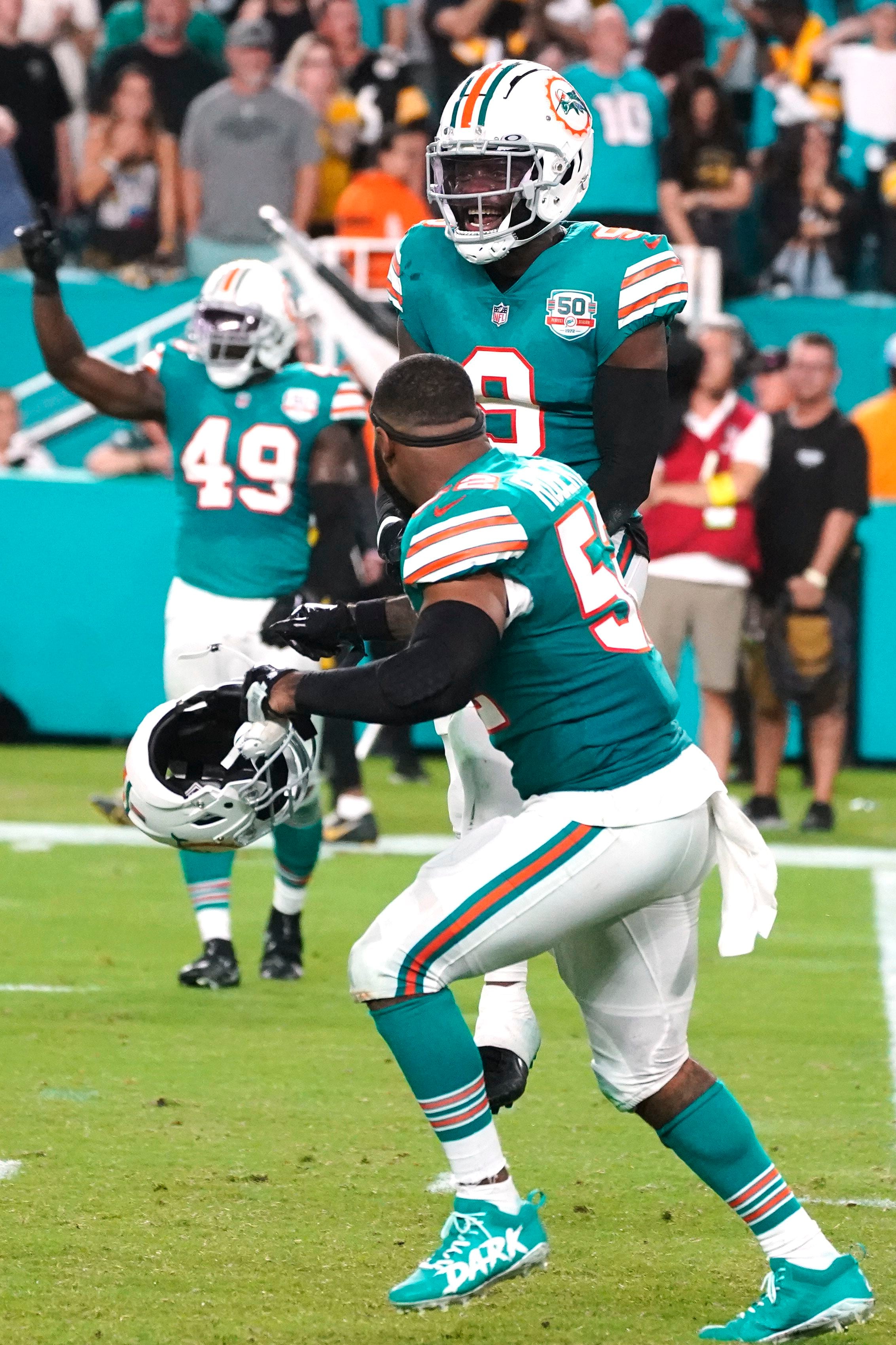 Miami Dolphins safety Brandon Jones (29) eyes the quarterback as he drops  back in coverage during an NFL football game against the Buffalo Bills,  Sunday, Sept. 25, 2022 in Miami Gardens, Fla.