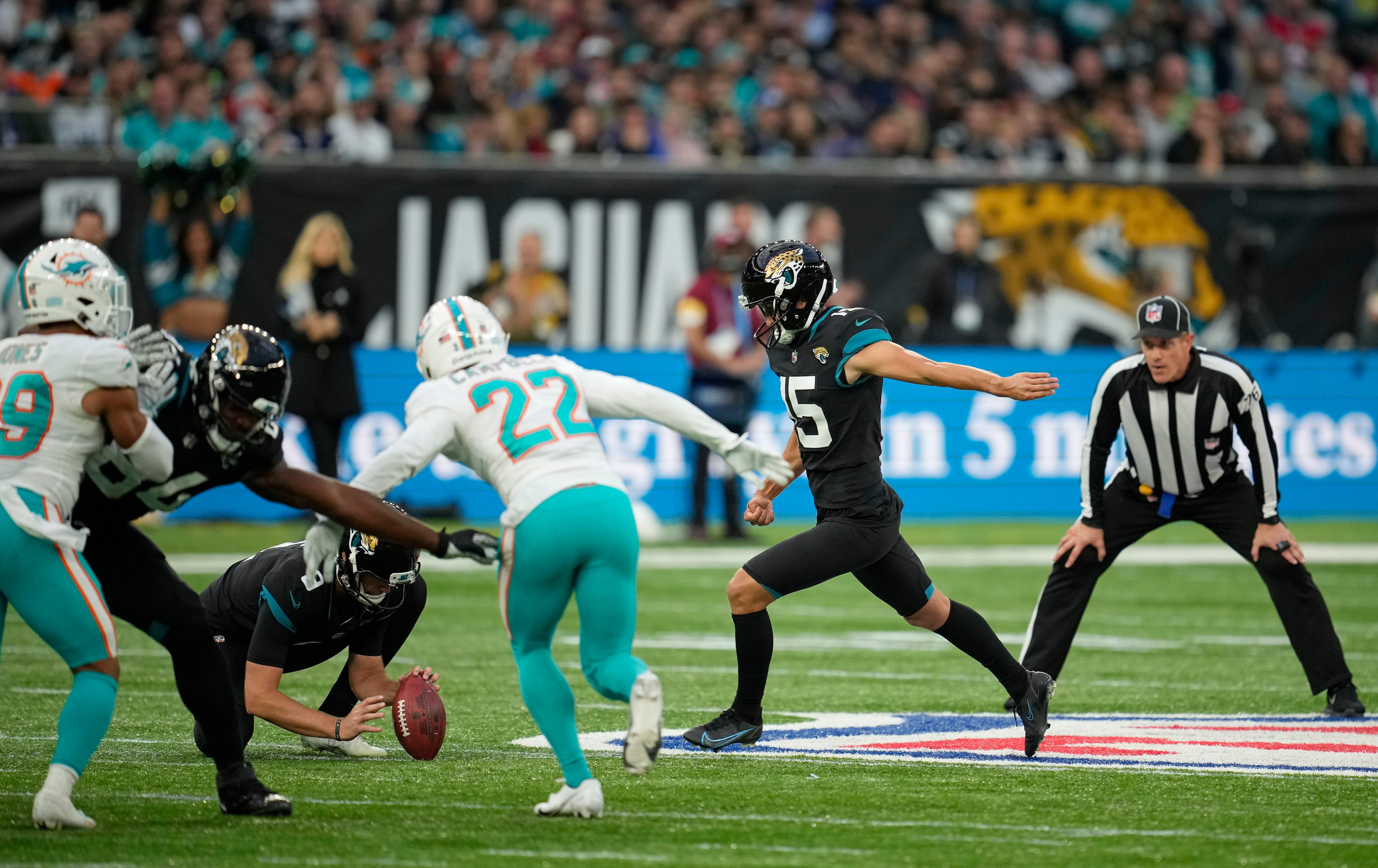 Miami Dolphins linebacker Jaelan Phillips (15) runs to the ball during the  second half of an NFL football game against the Jacksonville Jaguars at Tottenham  Hotspur Stadium in London, Sunday, Oct. 17