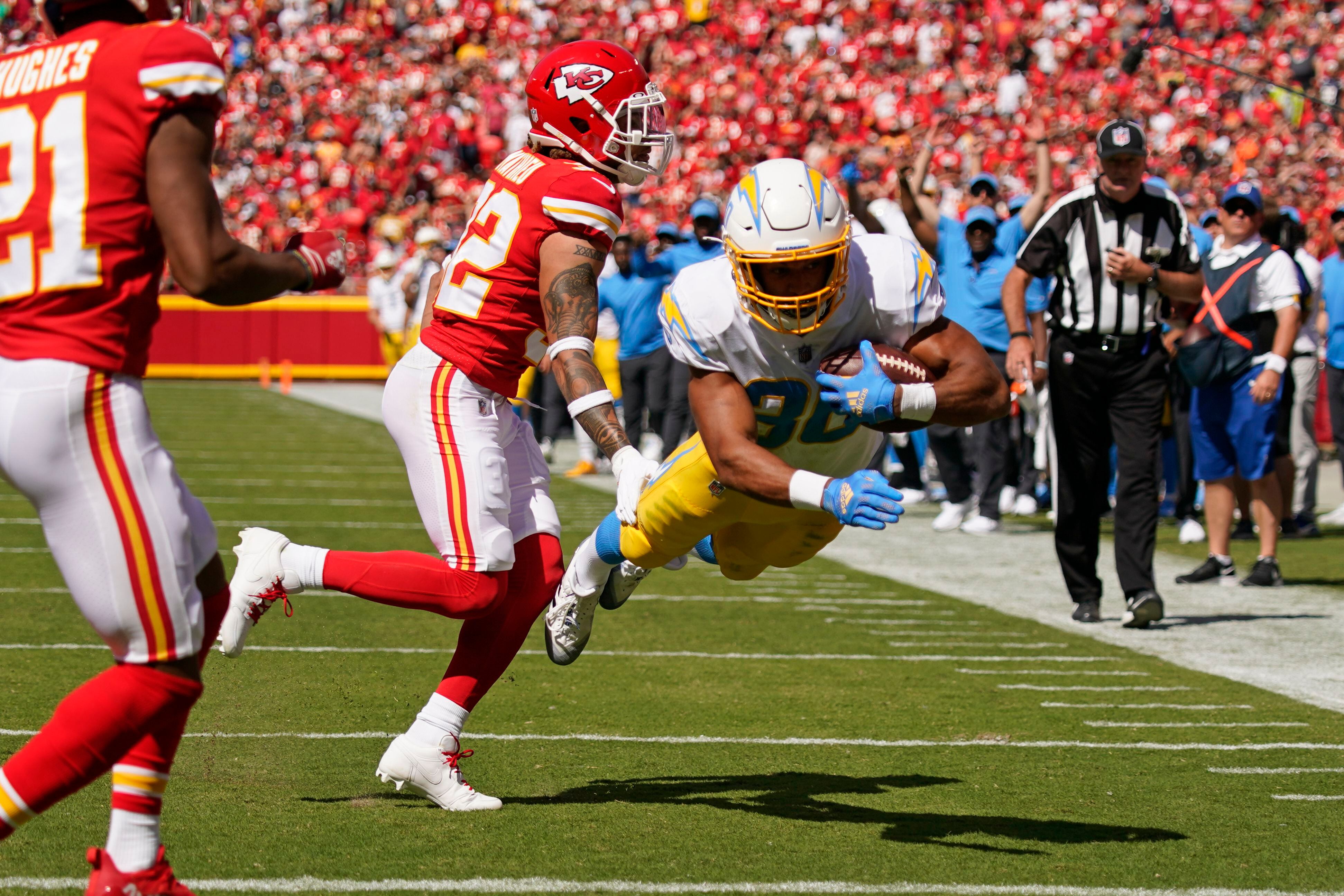 Kansas City Chiefs quarterback Patrick Mahomes runs the ball during the  second half of an NFL football game against the Los Angeles Chargers  Sunday, Sept. 26, 2021, in Kansas City, Mo. (AP