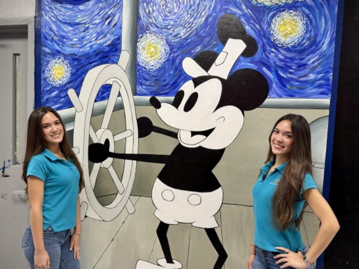Cutler Bay Senior High students Giselle and Gabriela Alonso and their Steamboat Willie / Starry Night mural.